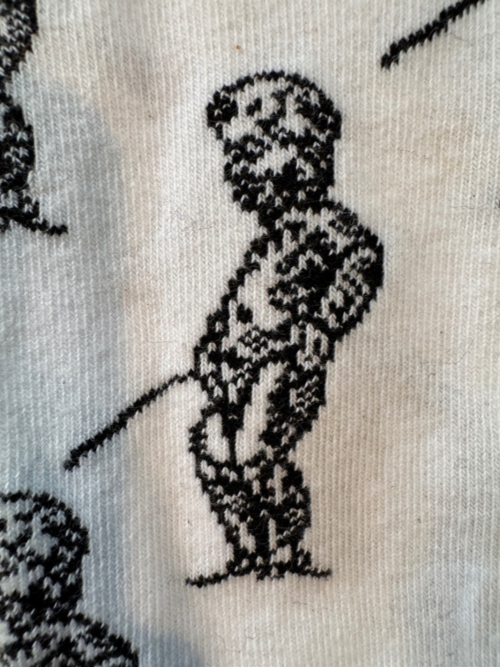 Socks from Belgium featuring a peeing cherub